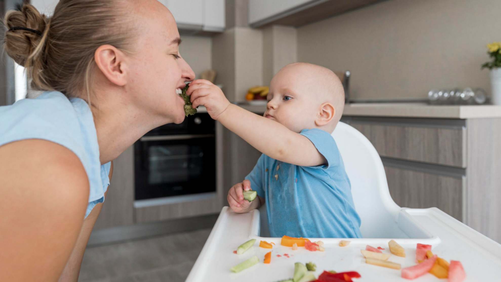 jpeg-optimizer_adorable-baby-playing-with-food-scaled